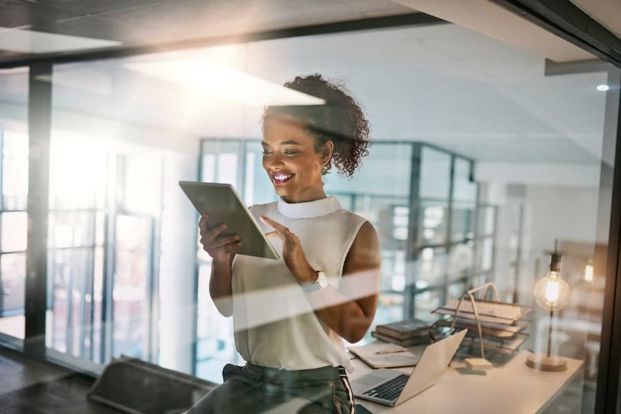Lady works in office on tablet