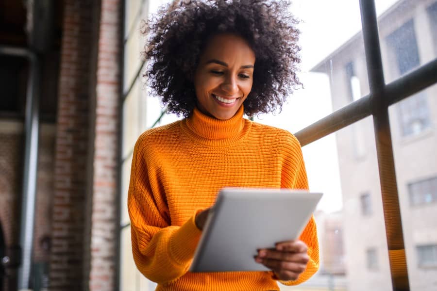 Team worker looks at tablet