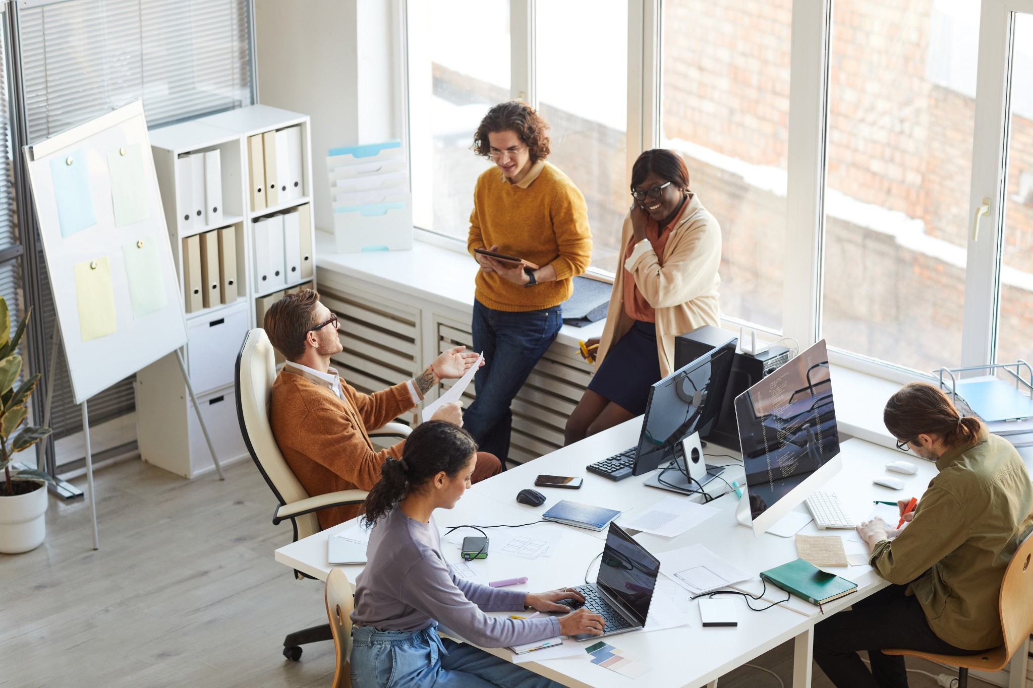 Team work together in Office with devices