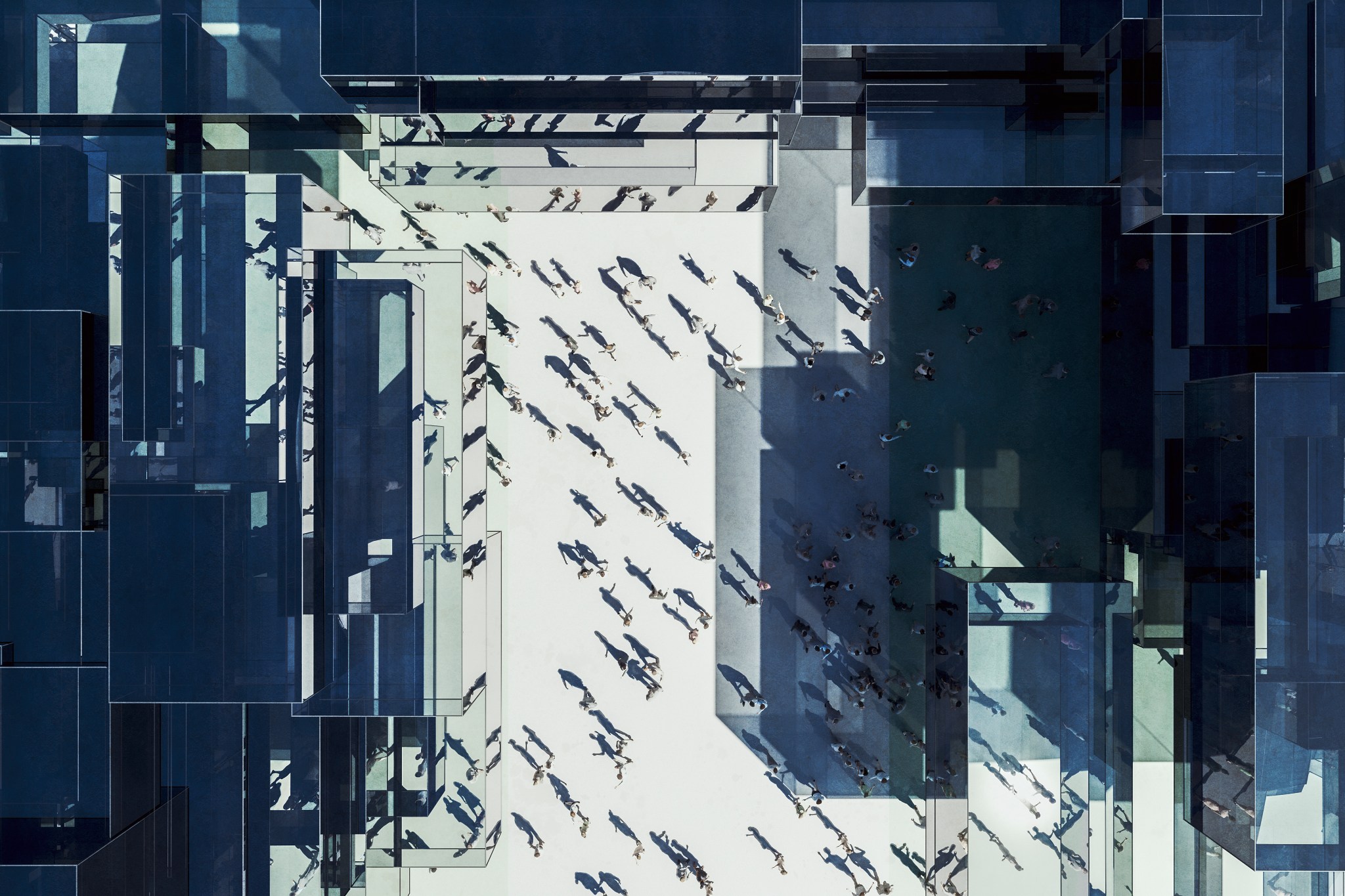 Modern glass office building with business people from above.